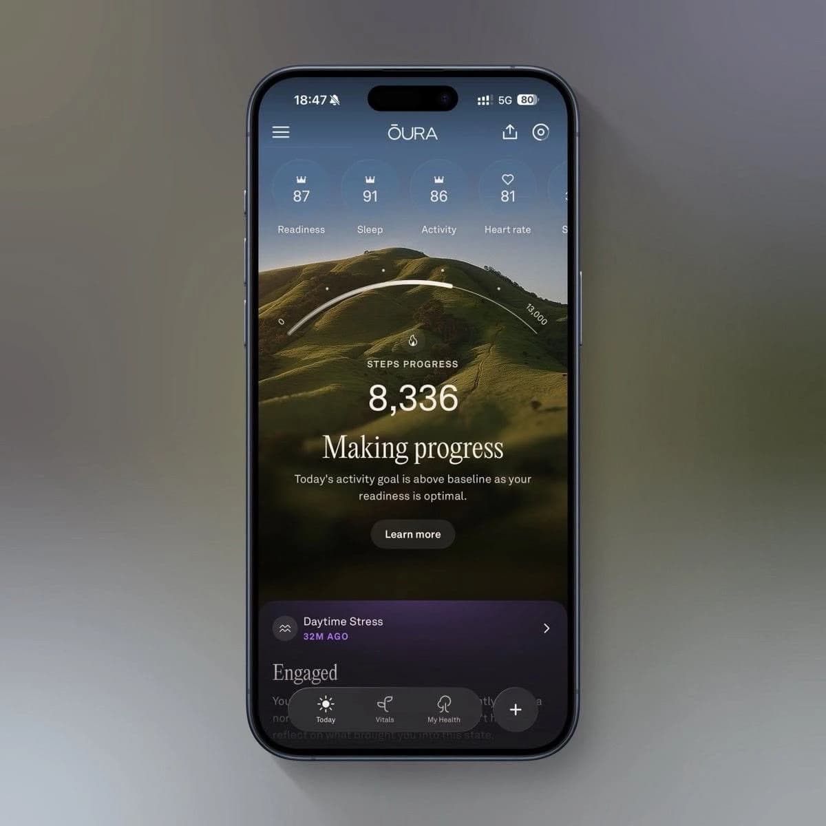 Oura app on a phone, showing 8,336 steps, Making progress, and a Learn more button
